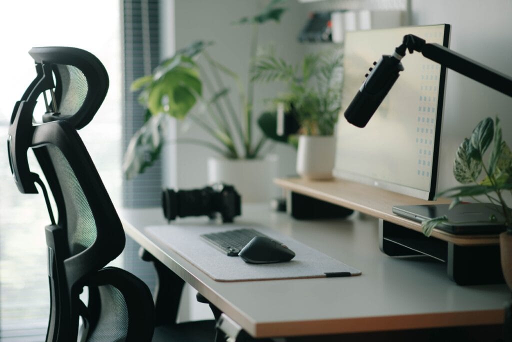 Minimalist desk reset setup featuring an ergonomic chair and clean elevated workspace.